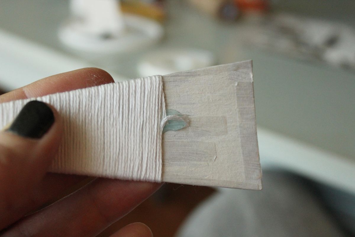 DIY String Tree Ornaments - attach your floss to the glue dot and cut it