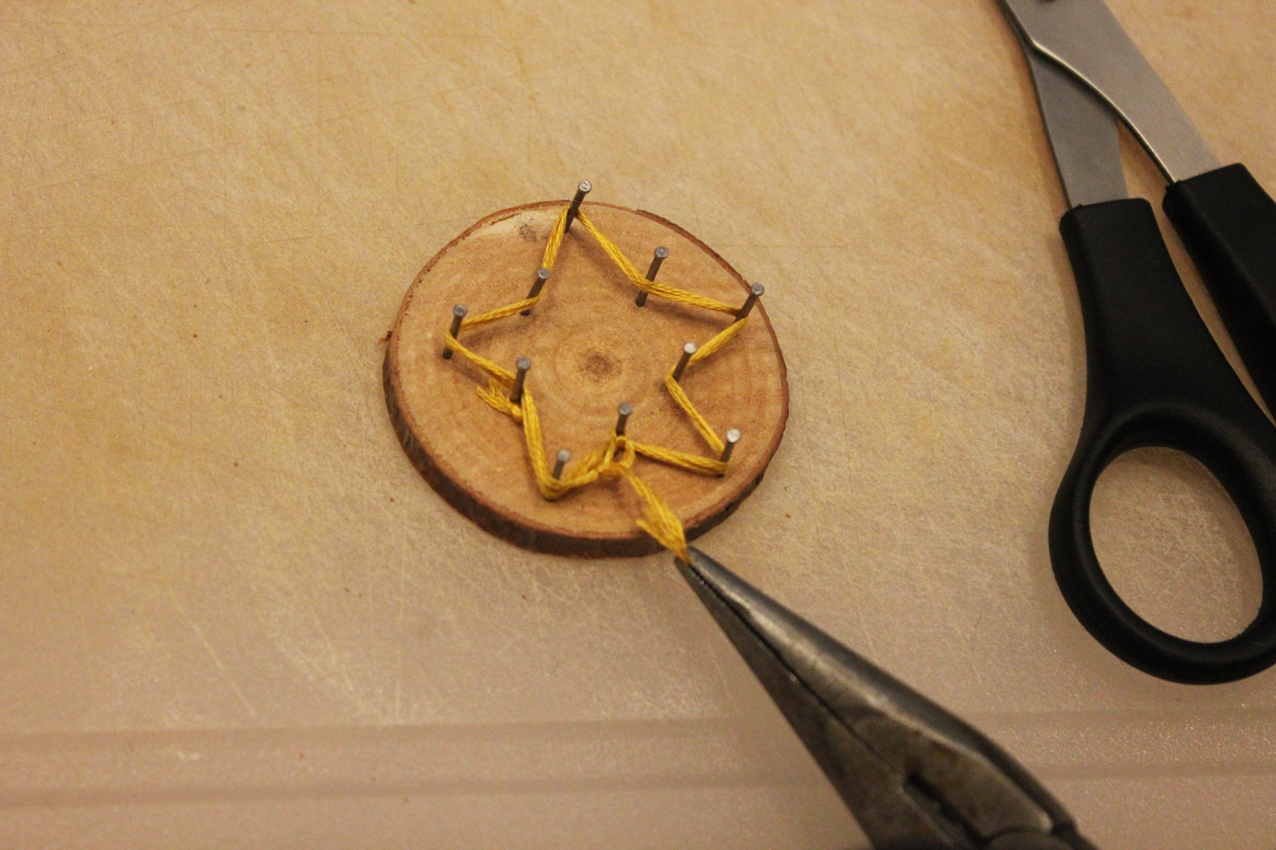 DIY string art ornaments on your Christmas tree