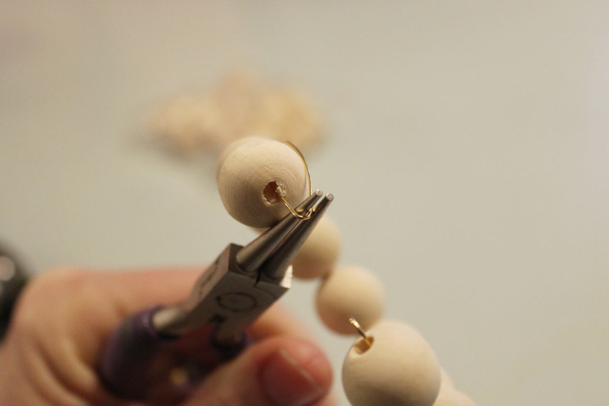 use your round nose pliers